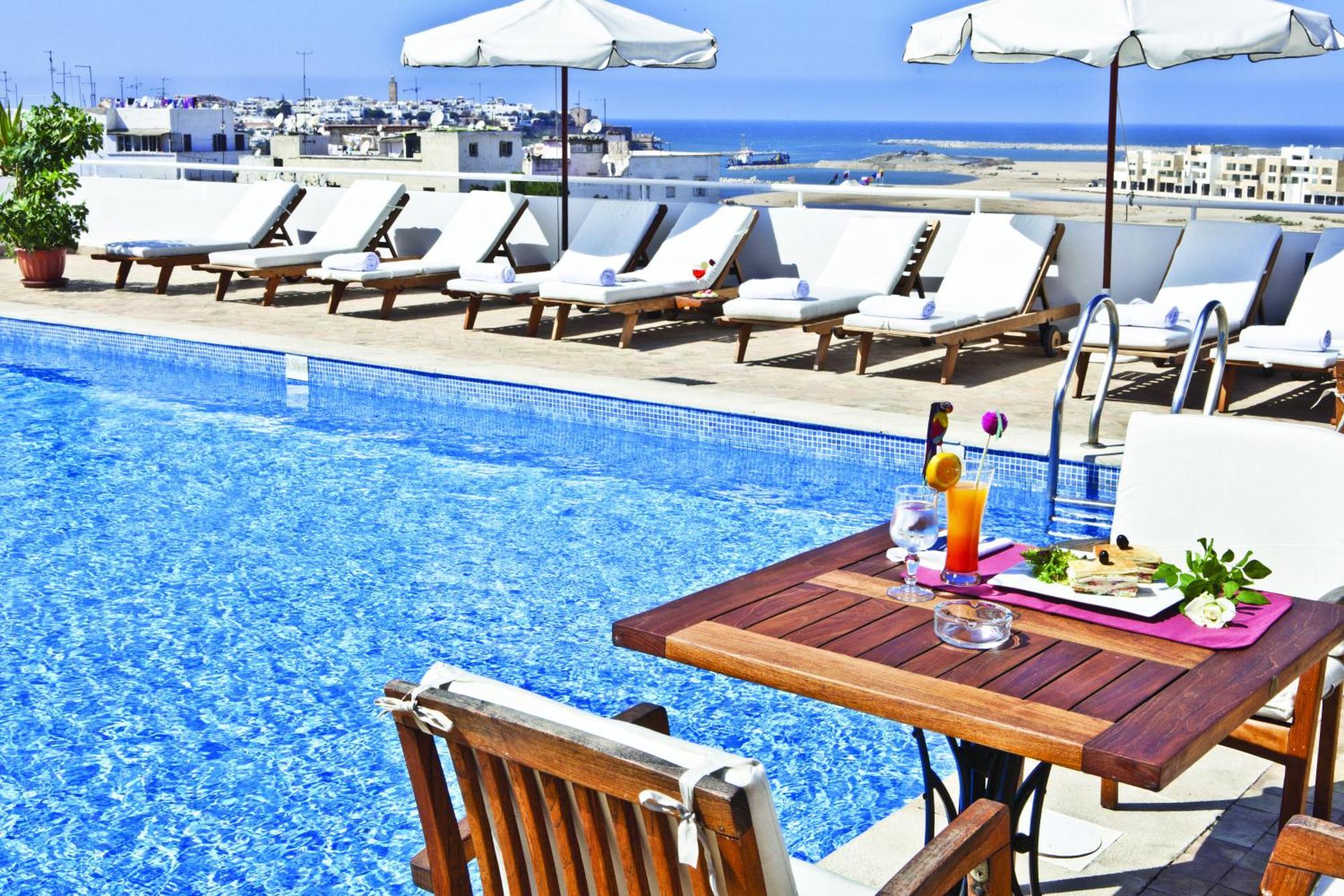 Farah Rabat Hotel Bagian luar foto The pool at the hotel